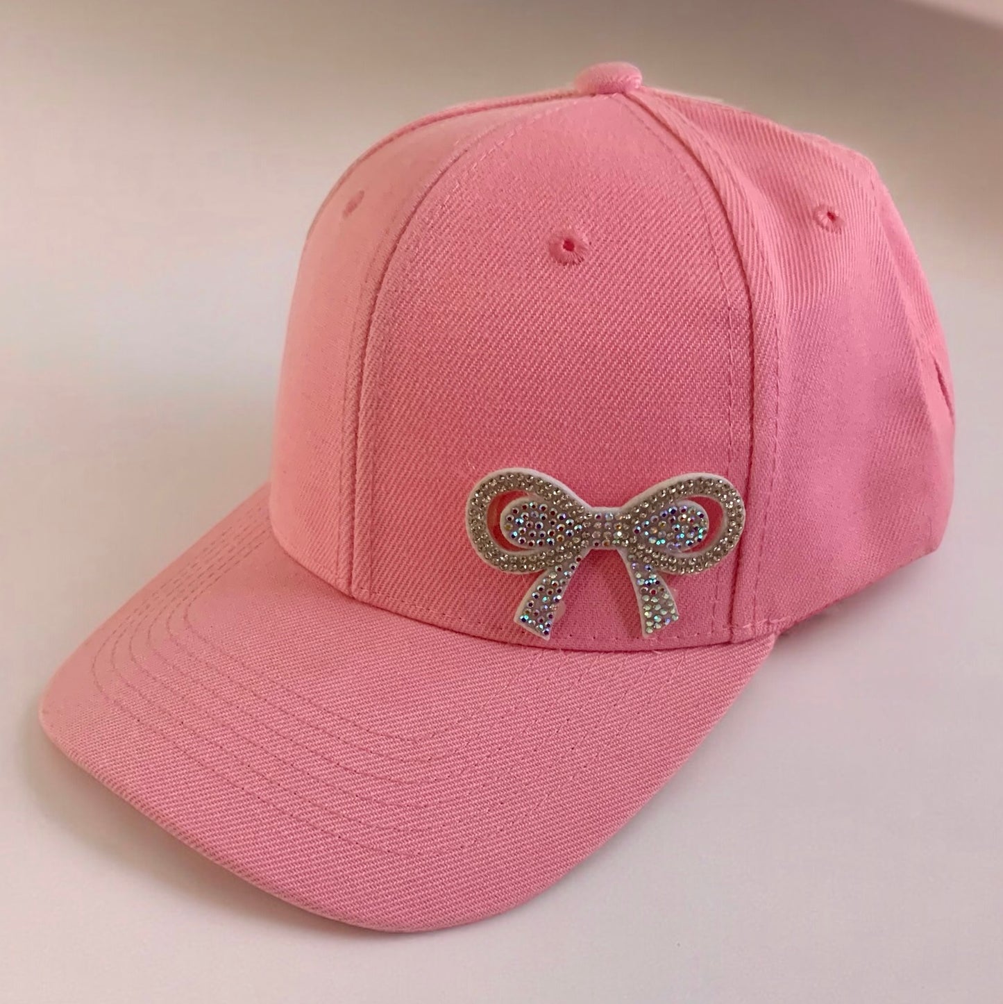 BASEBALL CAP BOW EMBELLISHED.  PACKAGE 6 CAPS. $6.90 UNIT PRICE